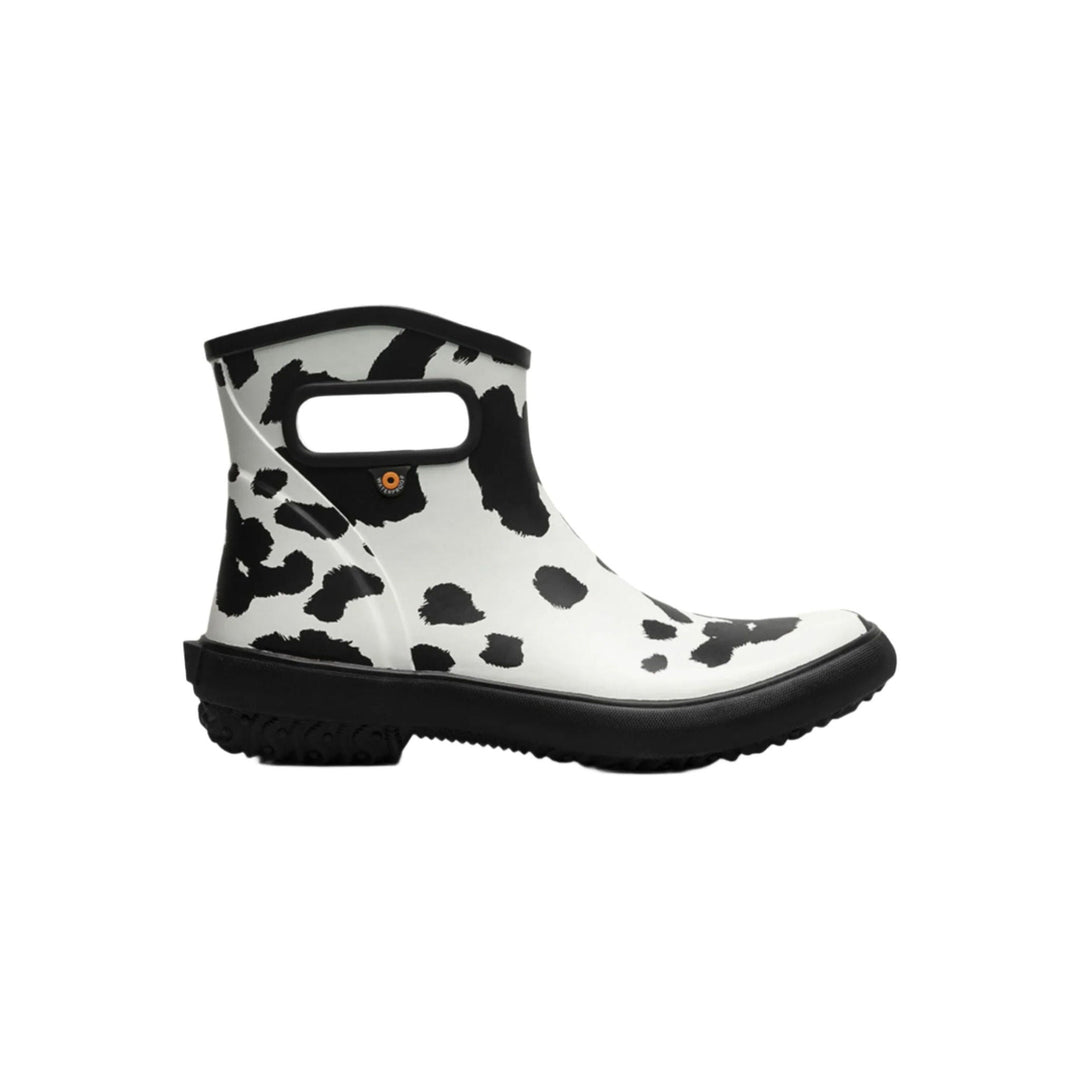 Black-and-white spotted ankle rain boot with a black sole and side pull opening