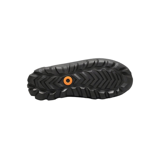 Black lugged boot outsole with an orange circular insert