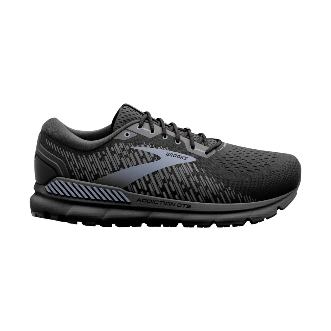 Black and gray running shoe with side logo, laced upper, and rugged outsole