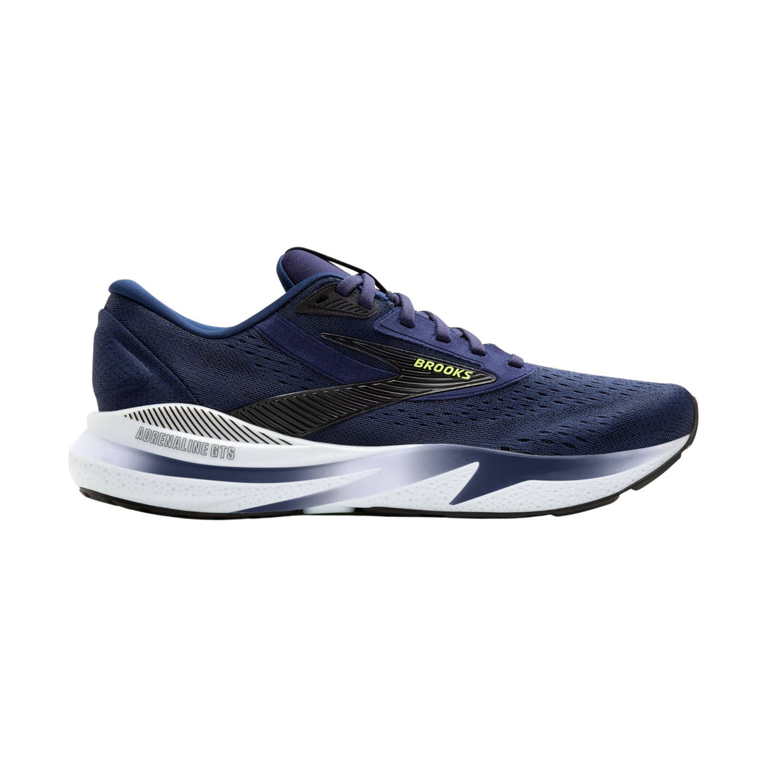 Navy blue running shoe with white cushioned sole, black side logo, and lime green Brooks text