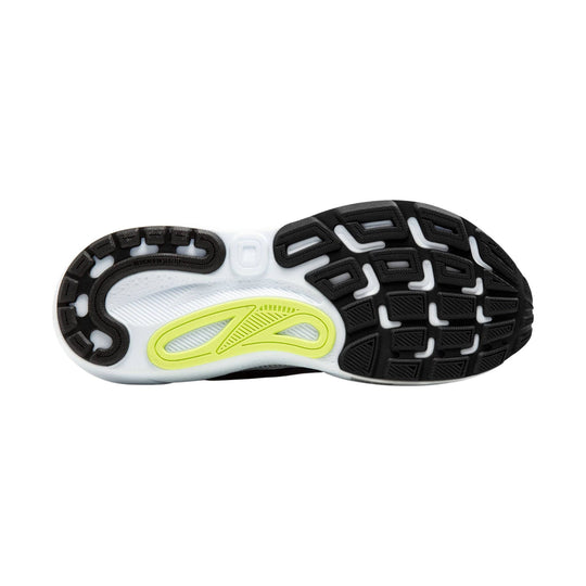 Black running shoe outsole with white midsole and neon yellow insert, showing tread pattern and "DESIGNED IN SEATTLE" text