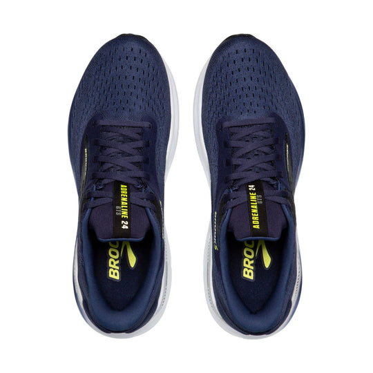 Pair of navy blue Brooks running shoes with white midsoles, laced uppers, and neon yellow branding