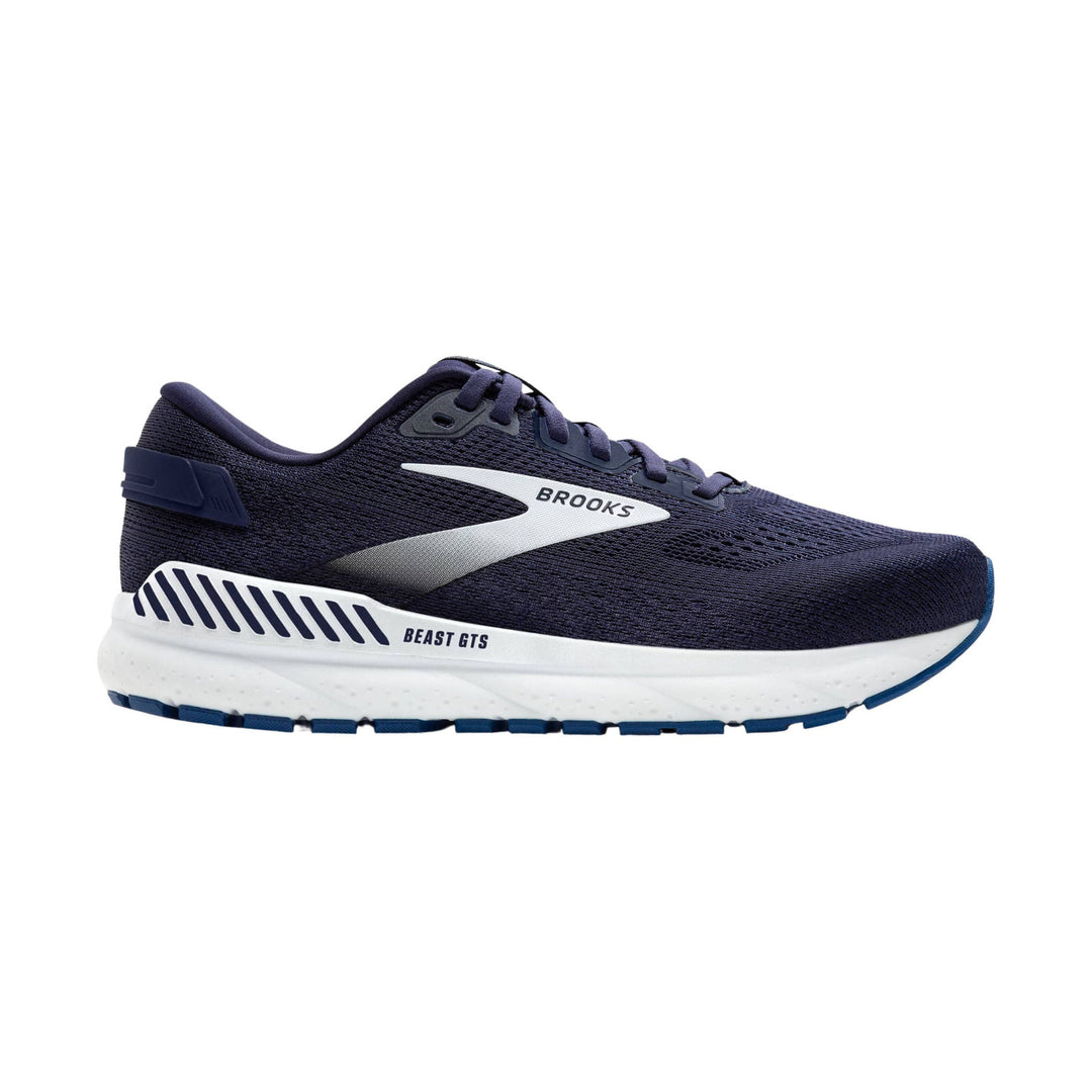 Navy running shoe with white cushioned sole and blue outsole accents, shown in side view