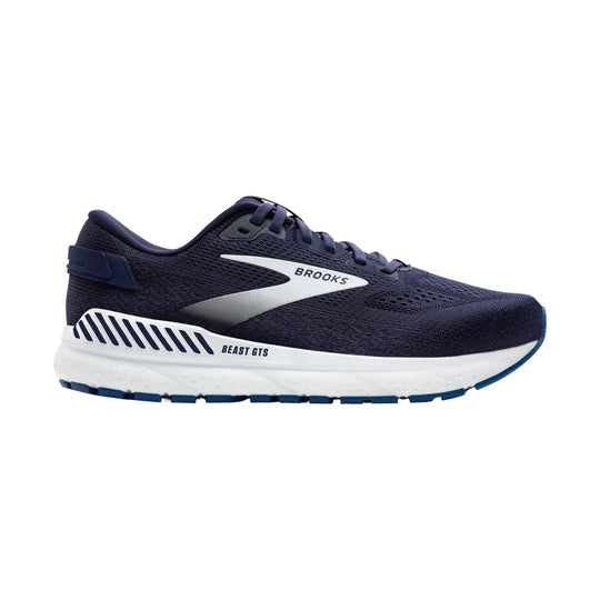 Navy running shoe with white cushioned sole and blue outsole accents, shown in side view