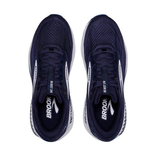 Pair of navy lace-up running shoes with white midsoles, shown from above
