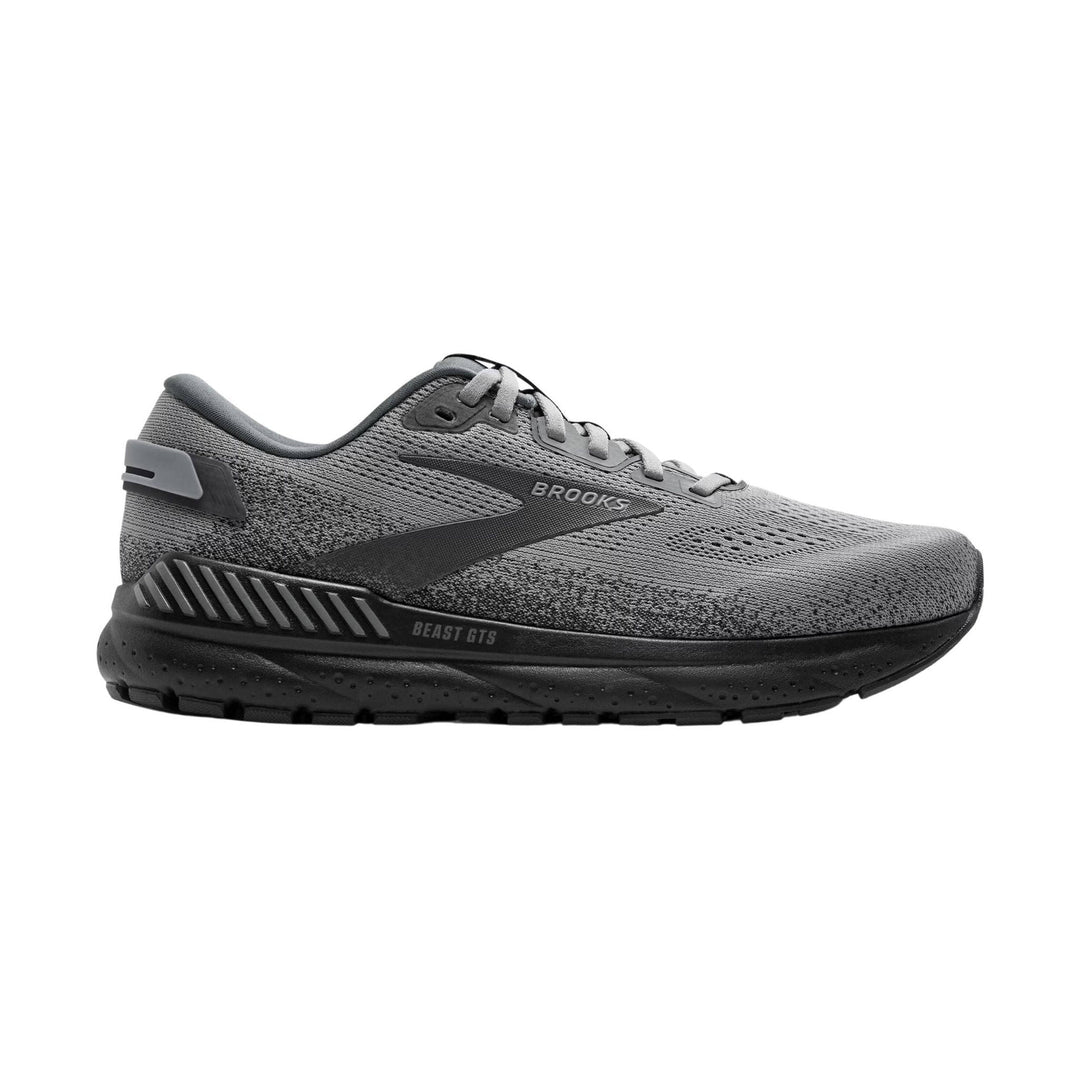 Gray and black running shoe with knit upper, side logo, and visible BEAST GTS text on the midsole