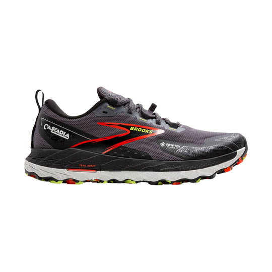 Black and gray trail running shoe with red side logo, white midsole, and rugged outsole