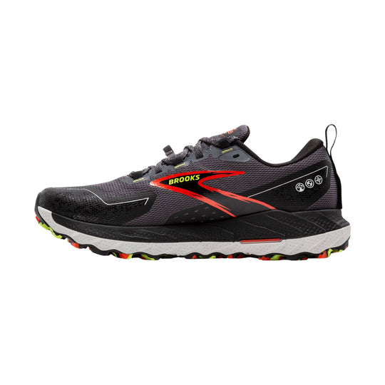 Black trail running shoe with red side logo, white midsole, and lugged outsole