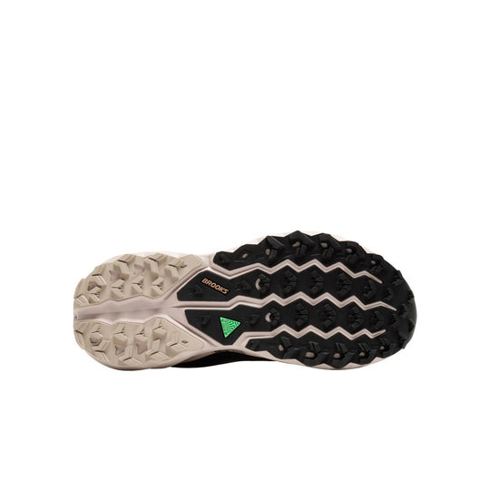 Trail shoe outsole with black and beige lugs and Brooks branding