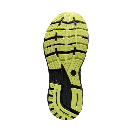 Lime green and black running shoe outsole with segmented tread and curved grooves