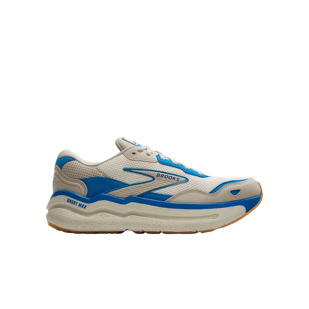Cream and blue Brooks running shoe shown in side profile with chunky sole and gum outsole