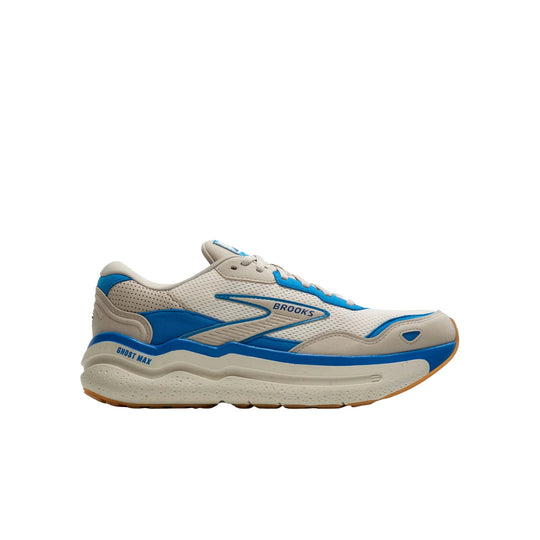 Cream and blue Brooks running shoe shown in side profile with chunky sole and gum outsole