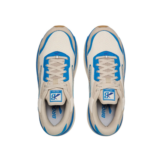 Pair of cream and blue mesh running shoes with white laces and Brooks branding
