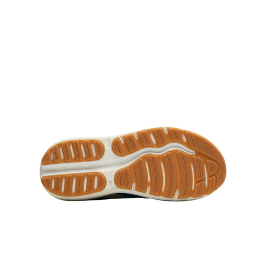 Shoe outsole with orange rubber tread and white foam midsole, shown from below
