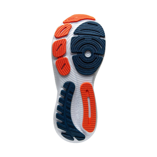 Running shoe outsole with navy and orange traction pods and a white midsole