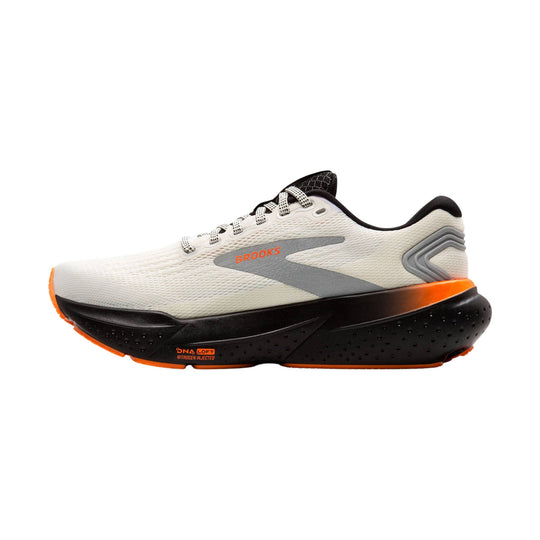 White and black running shoe with orange accents and a thick cushioned sole, side view