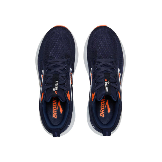 Pair of navy running shoes with orange accents and white midsoles, shown from above