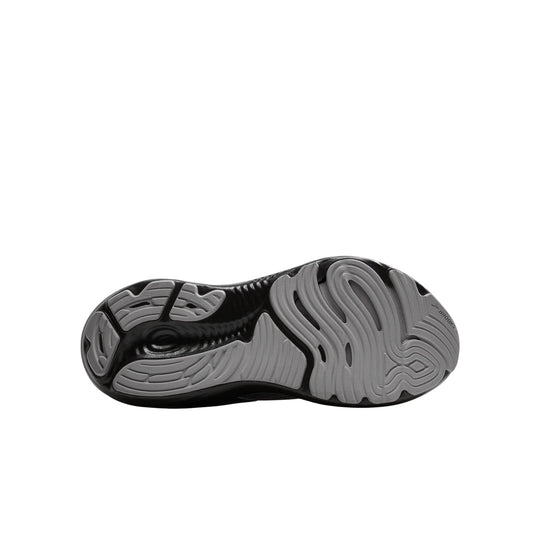 Black and gray running shoe outsole with grooved traction patterns and Brooks branding