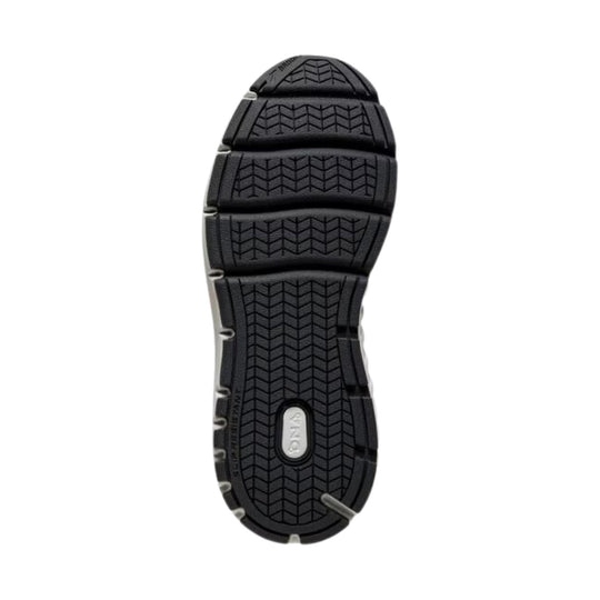 Black walking shoe outsole with deep tread and gray brand insert