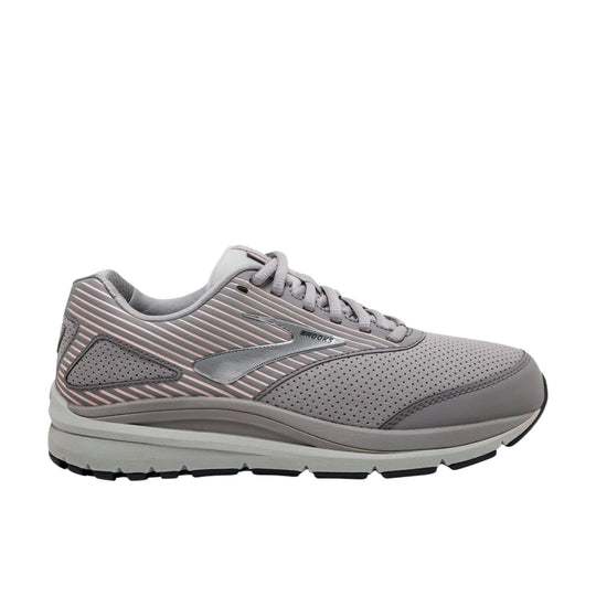 Gray lace-up walking shoe with perforated upper, pink striped side detailing, and Brooks logo