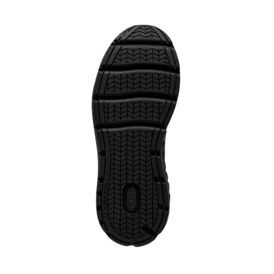 Black walking shoe outsole with deep traction tread and segmented sole design