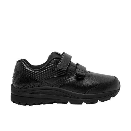Black walking shoe with two hook-and-loop straps, textured leather upper, and thick rubber sole