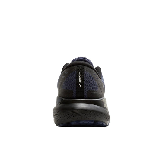 Rear view of a black running shoe with blue knit heel panel and Brooks branding