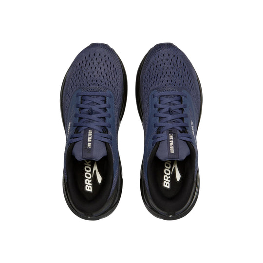 Pair of navy blue running shoes with black soles and visible BROOKS branding