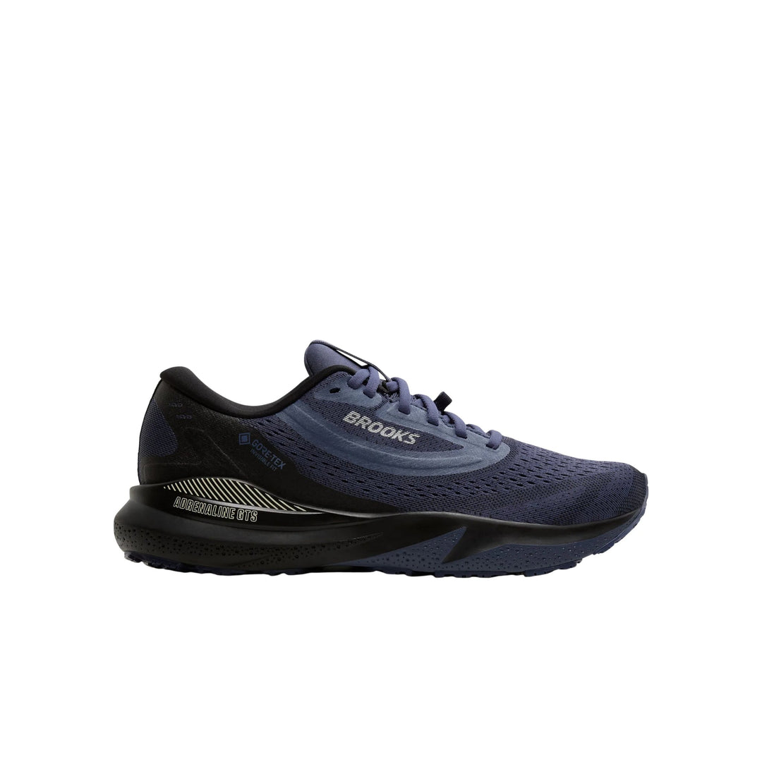 Blue and black running shoe with thick cushioned sole and visible Brooks and GORE-TEX text