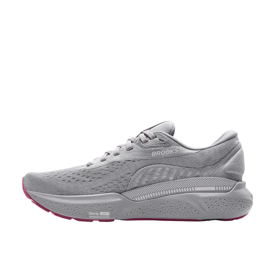 Gray running shoe with pink outsole accents and side support panel