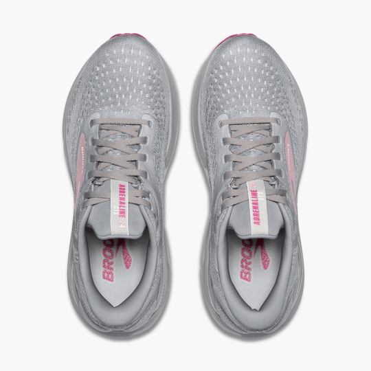 Pair of light gray Brooks running shoes with pink accents, seen from above