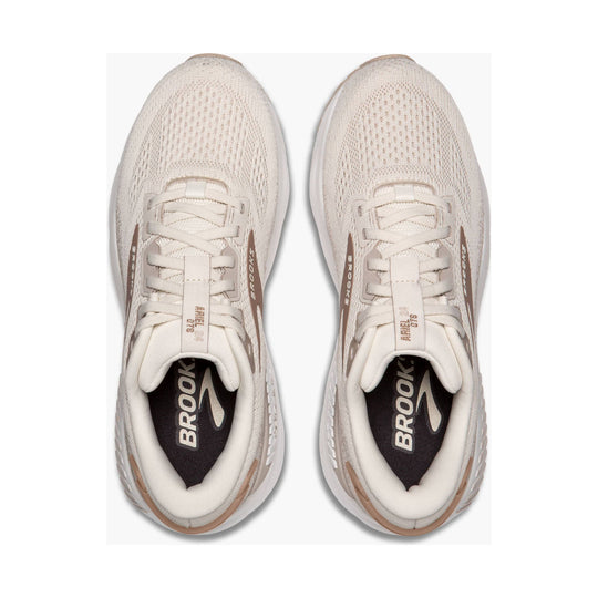 Pair of cream mesh running shoes viewed from above with Brooks branding and tan accents
