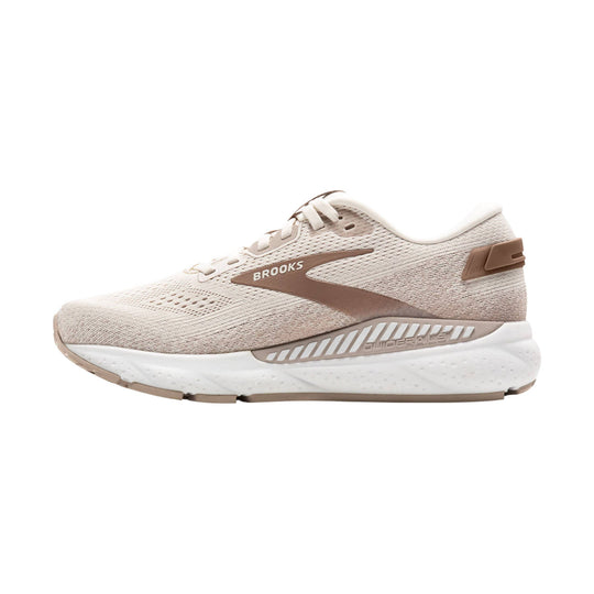 Beige and white running shoe with knit upper, side logo, and cushioned sole