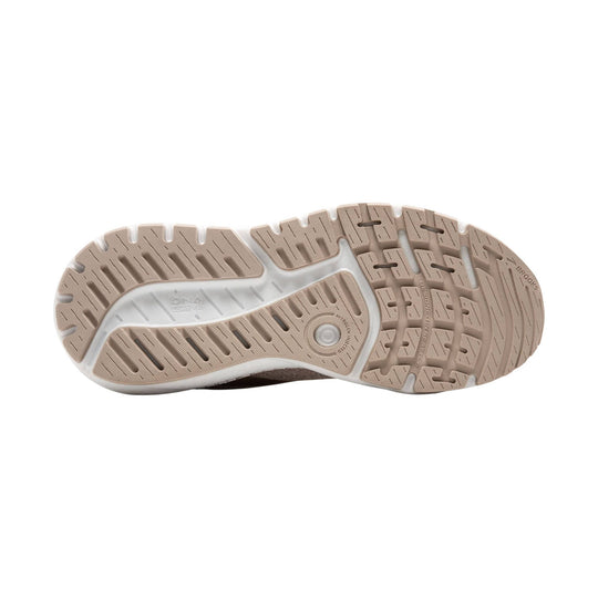 Beige running shoe outsole with segmented tread, Brooks branding, and nitrogen-infused cushioning markings
