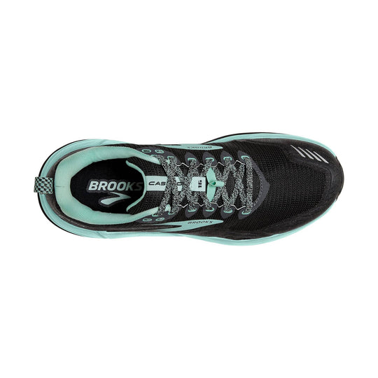 Black trail running shoe with mint green trim and gray laces, shown from the top.