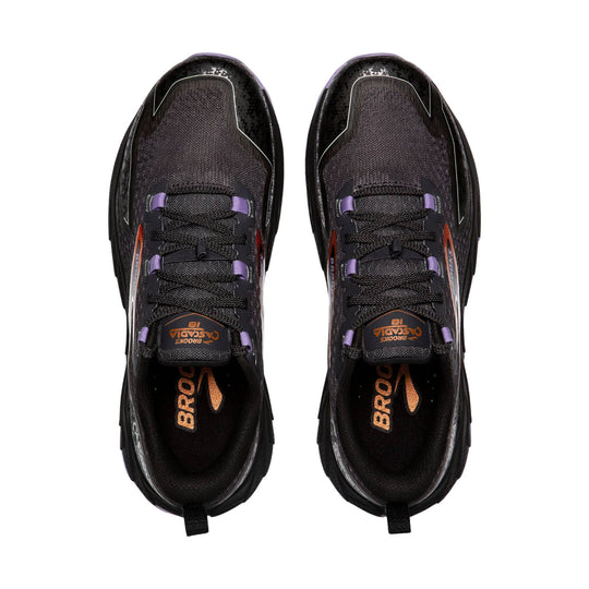Black trail running shoes with purple lace loops and orange Brooks branding, top view