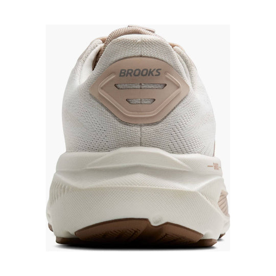 Cream and beige running shoe seen from the heel with BROOKS on the back tab