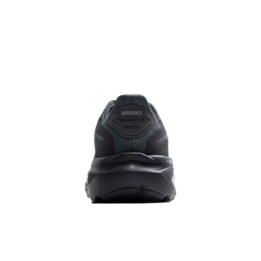 Black running shoe seen from the heel with a Brooks logo