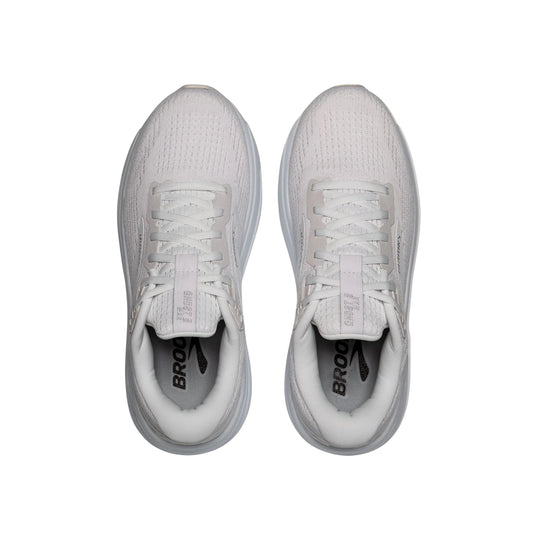 Pair of white running shoes with cushioned collars, lace-up fronts, and thick gray soles