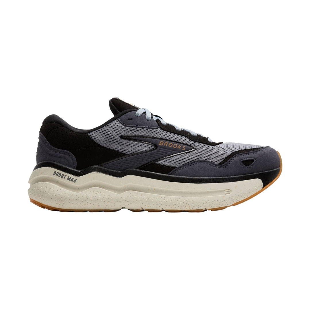 Side view of a black, gray, and white running shoe with a thick cushioned sole