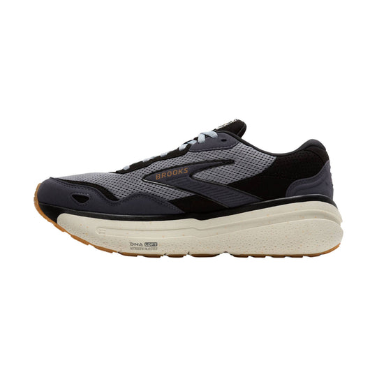 Side view of a black, gray, and white running shoe with a thick cushioned sole and visible Brooks logo