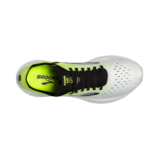 White running shoe with neon yellow interior, black laces, and perforated toe box, shown from above