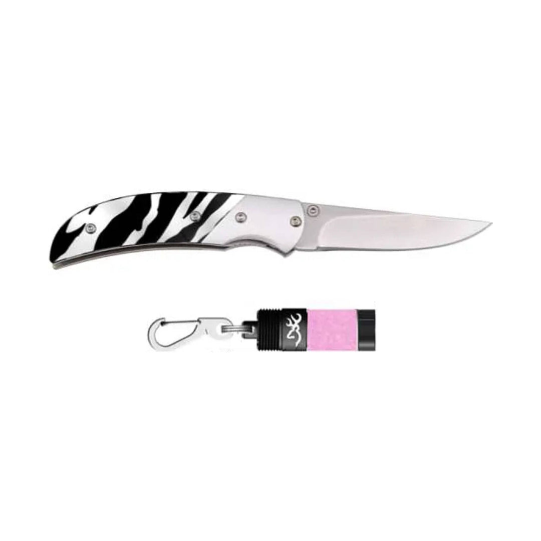 Folding knife with zebra-striped handle and a small pink flashlight with clip