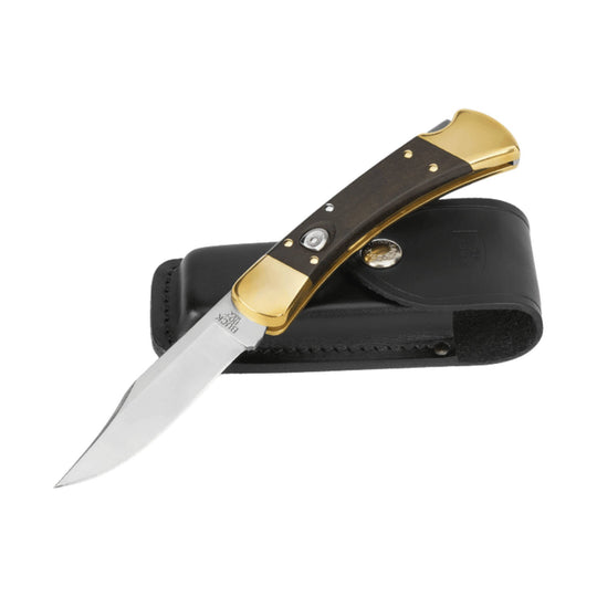 Folded black-and-gold folding knife in a black leather sheath, with the blade open and visible