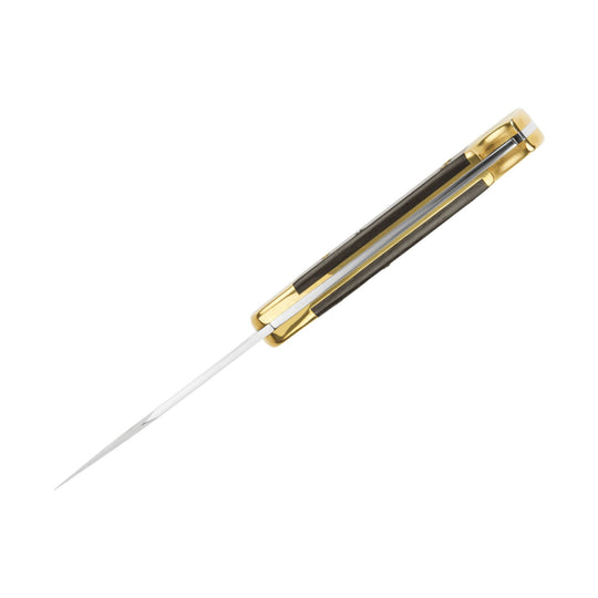 Folding knife with brass handle, dark inlay, and partially open silver blade