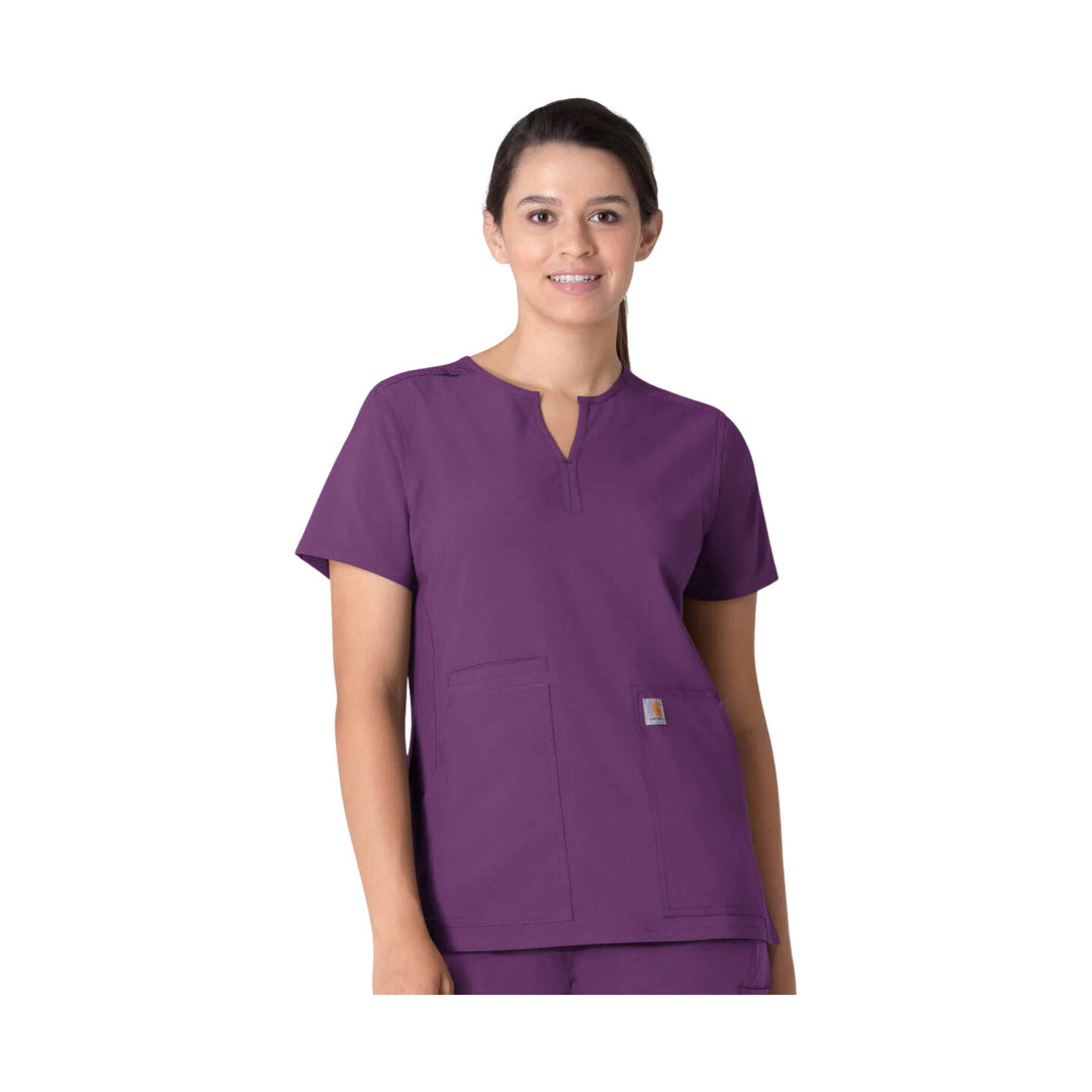 Purple short-sleeve scrub top with notch neckline and front patch pockets