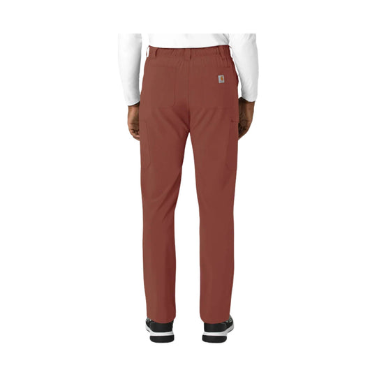 Back view of rust-colored straight-leg scrub pants with elastic waistband and side pockets