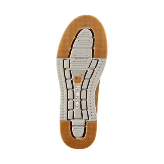 Shoe outsole with gray segmented tread and tan rubber edges, showing Carhartt logo on the sole