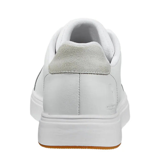 White leather sneaker shown from the back with a padded collar, suede heel panel, and gum outsole