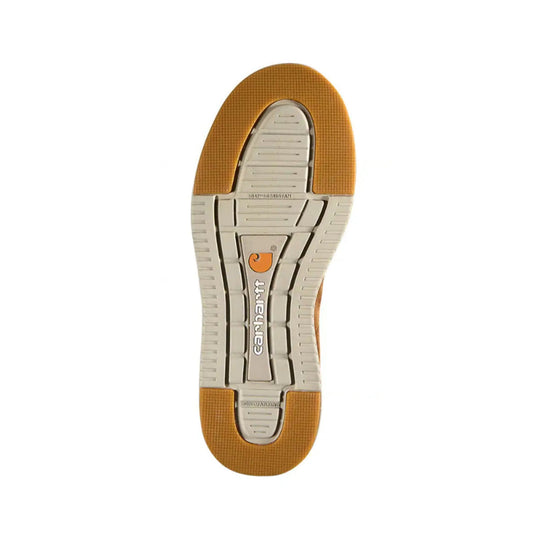 Outsole of a tan and gray slip-on shoe with orange traction pads and visible tread text
